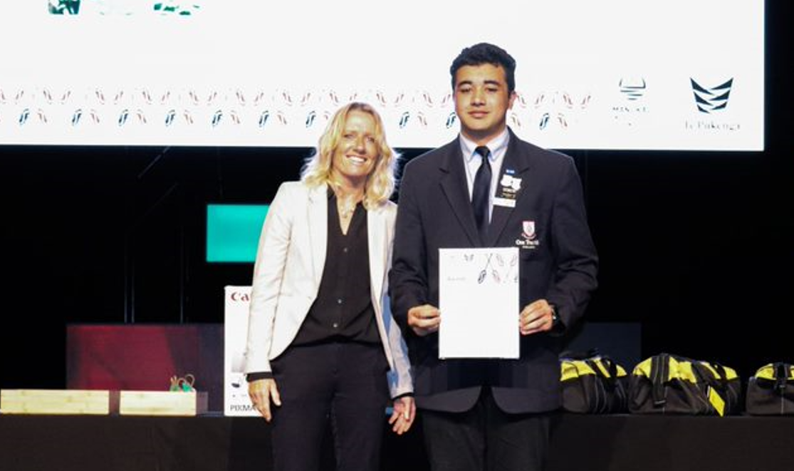 Dominic Lo from One Tree Hill College receive their awards at MIT Trades Academy Prize Giving